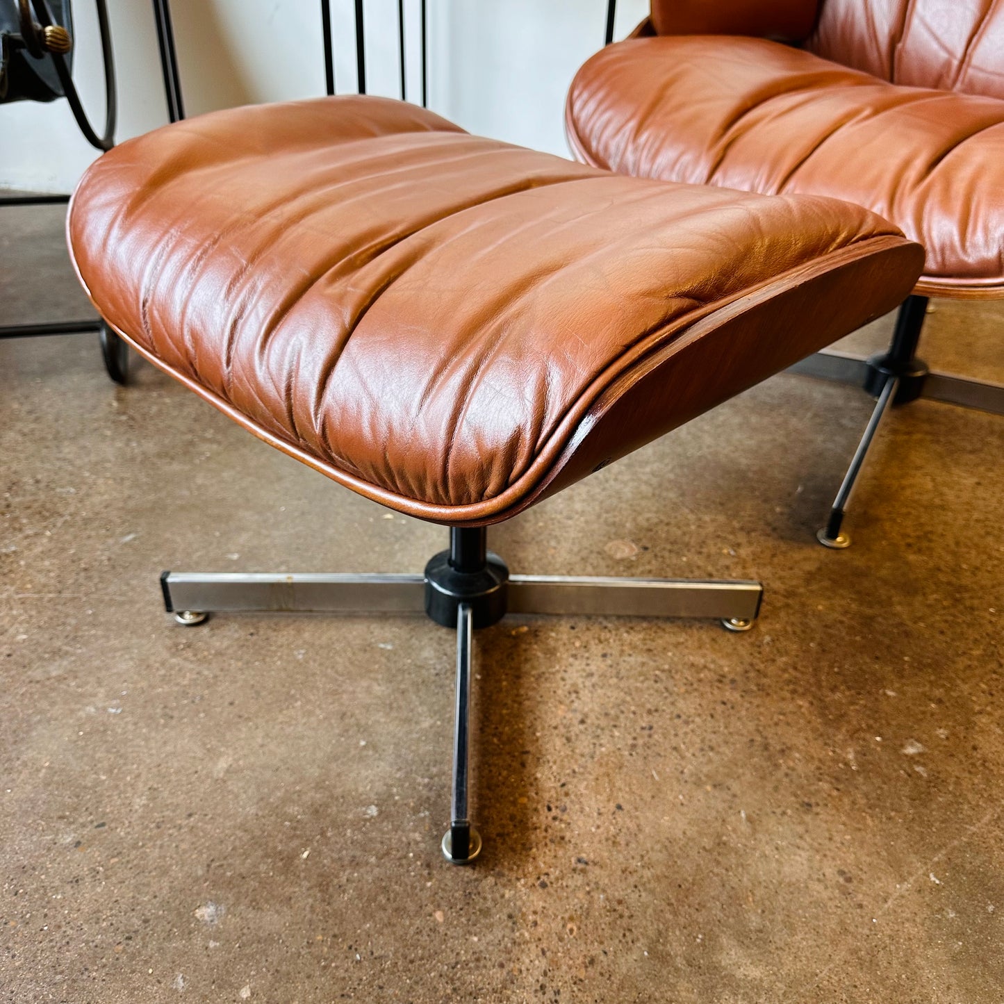 VINTAGE PLYCRAFT COGNAC AND WALNUT LOUNGE CHAIR AND OTTOMAN