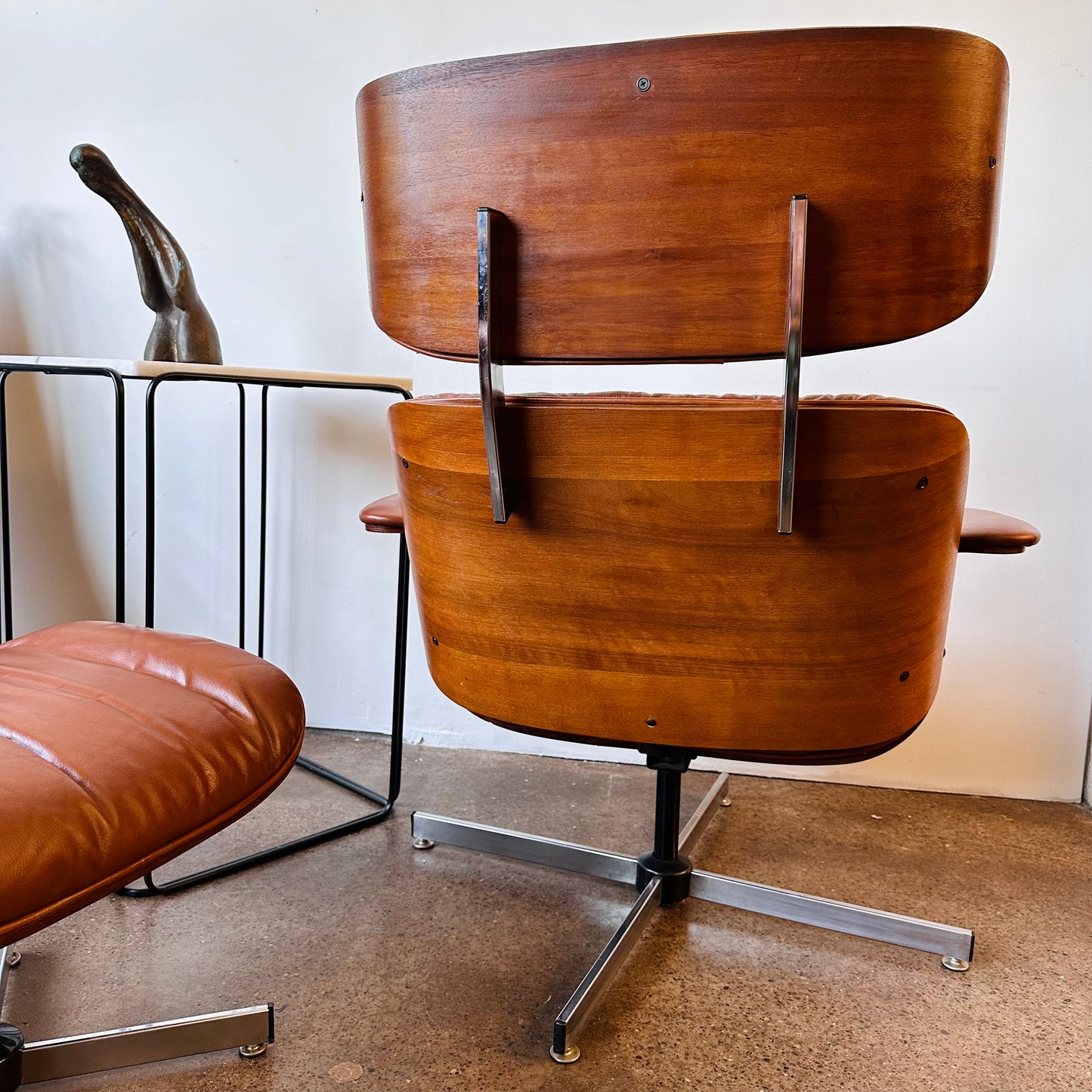 VINTAGE PLYCRAFT COGNAC AND WALNUT LOUNGE CHAIR AND OTTOMAN