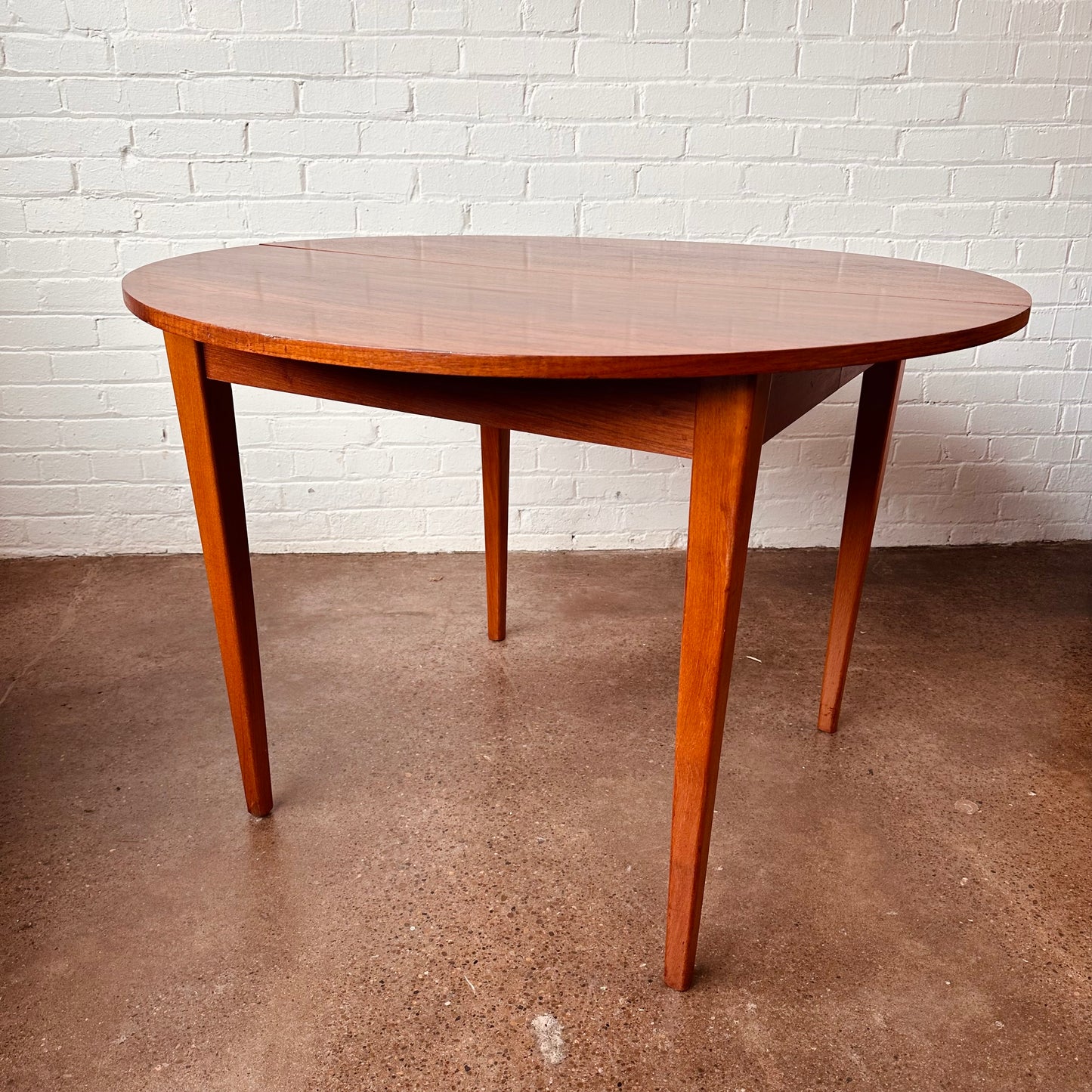 DANISH TEAK ROUND TO OVAL DINING TABLE WITH LEAF - RESTORED