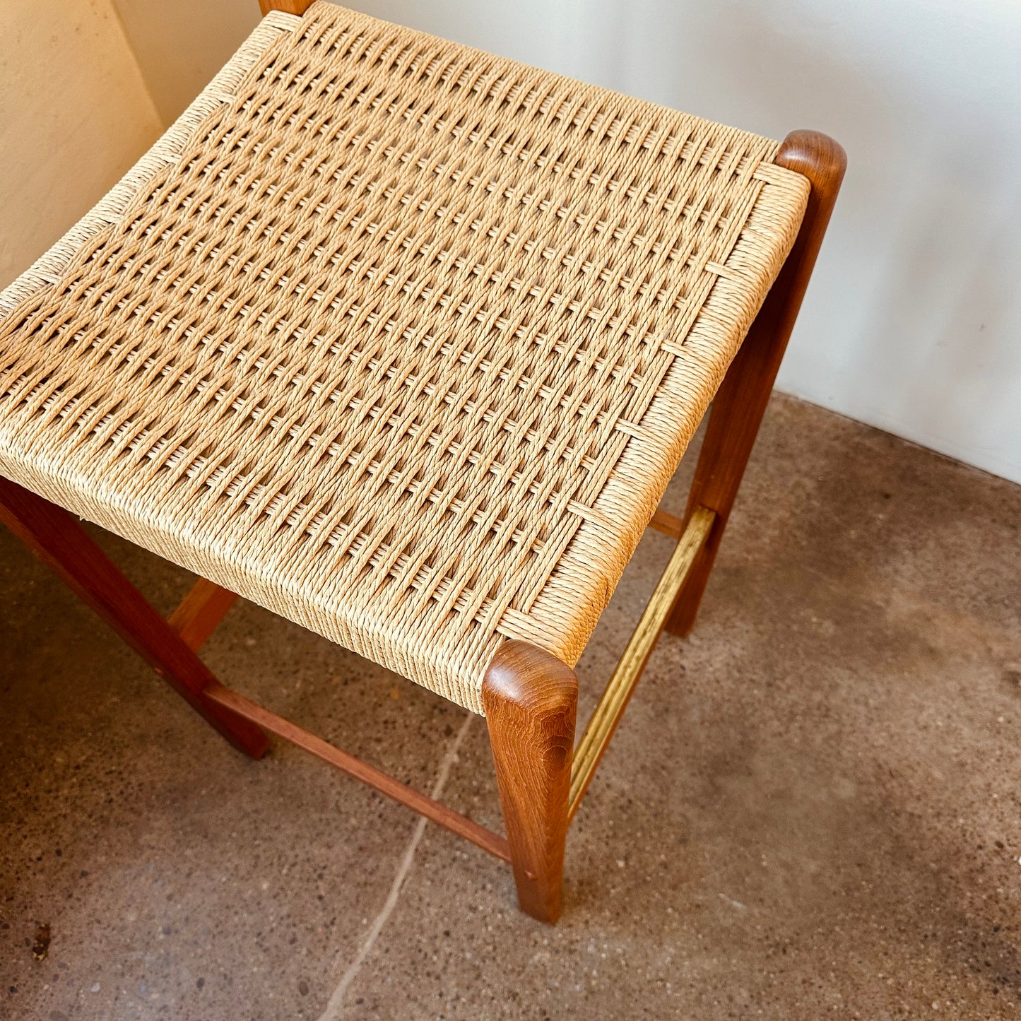 PAIR OF MODERN TEAK AND PAPER CORD BAR STOOLS
