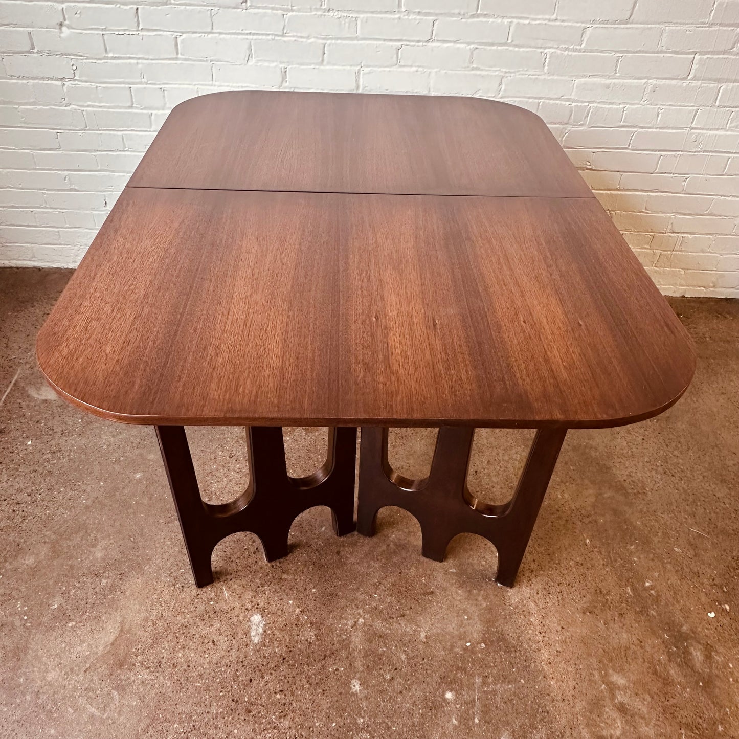 WALNUT DINING TABLE WITH SCULPTURAL BASE
