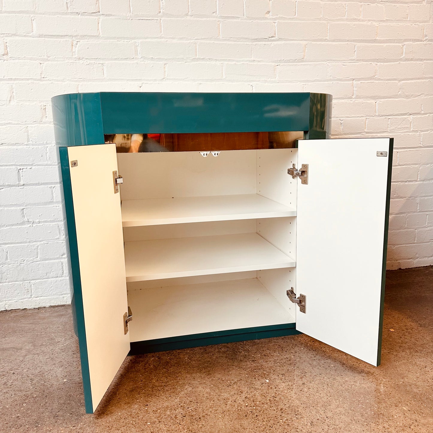 POST MODERN LACQUERED LAMINATE OVAL CABINET