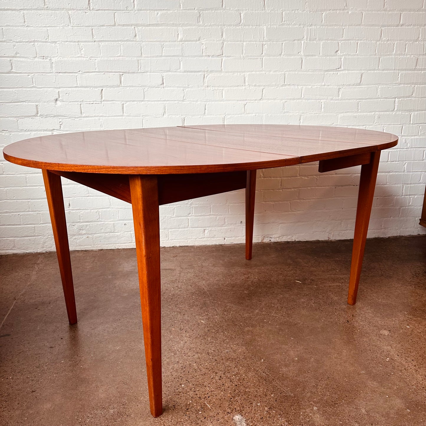 DANISH TEAK ROUND TO OVAL DINING TABLE WITH LEAF - RESTORED