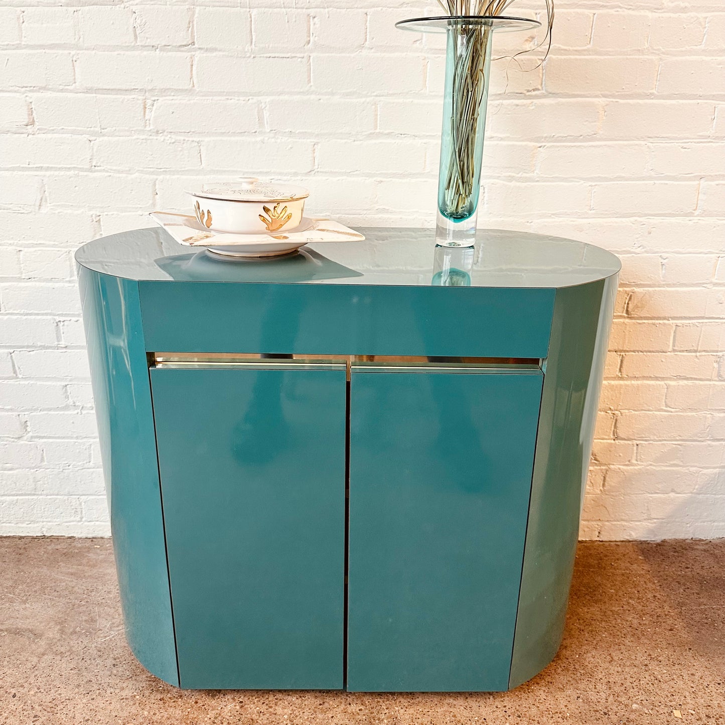 POST MODERN LACQUERED LAMINATE OVAL CABINET