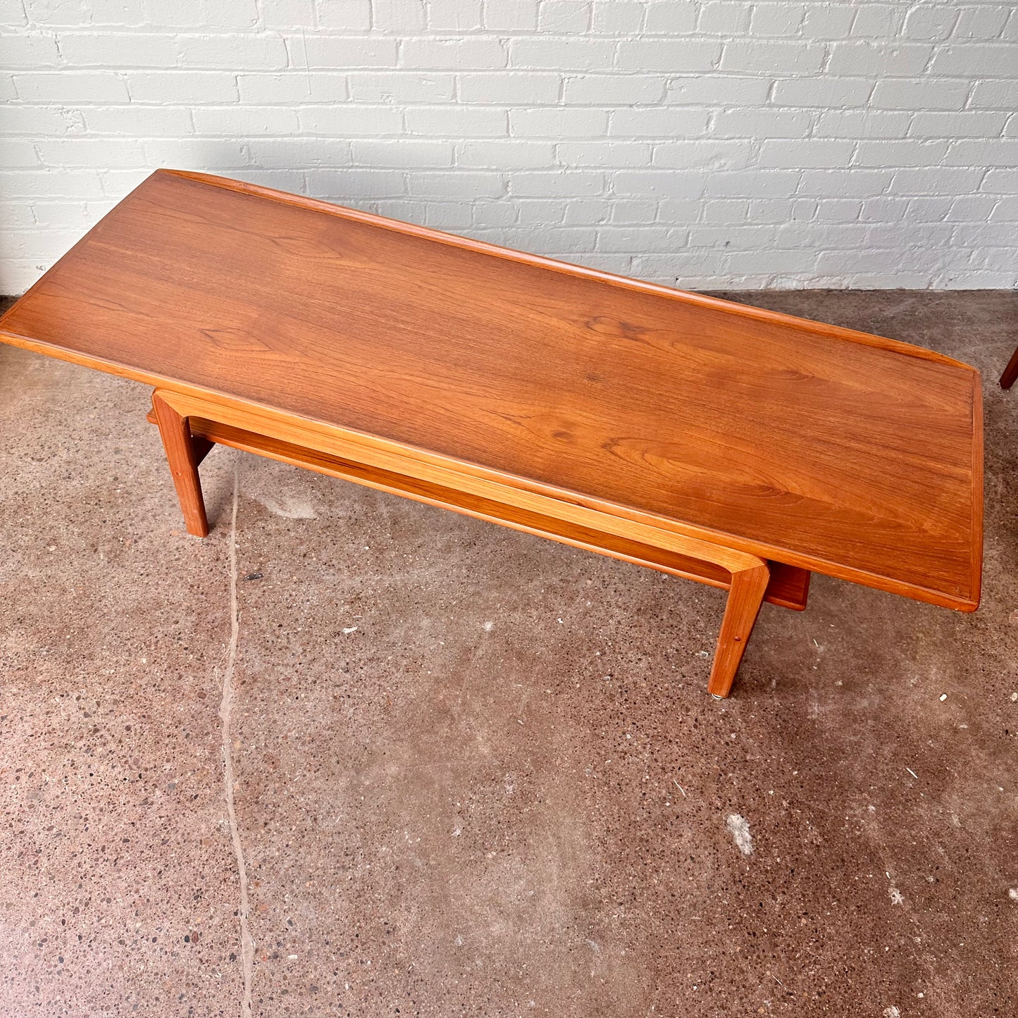 RESTORED DANISH TEAK COFFEE TABLE WITH SCULPTED LEGS
