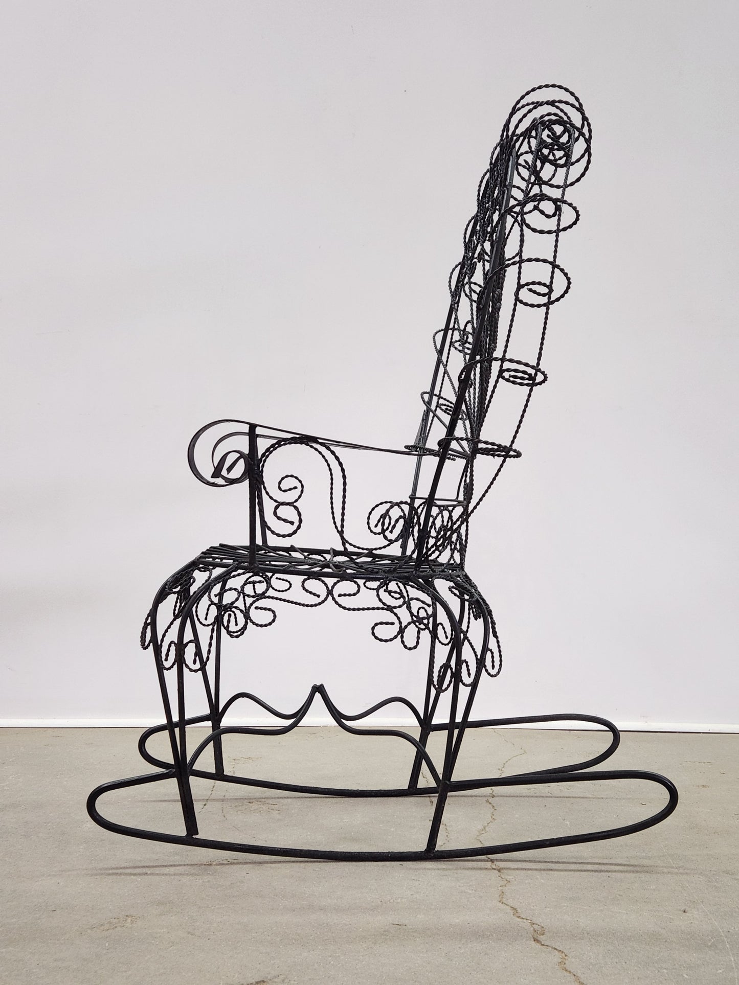 JOHN SALTERINI IRON PEACOCK ROCKING CHAIR