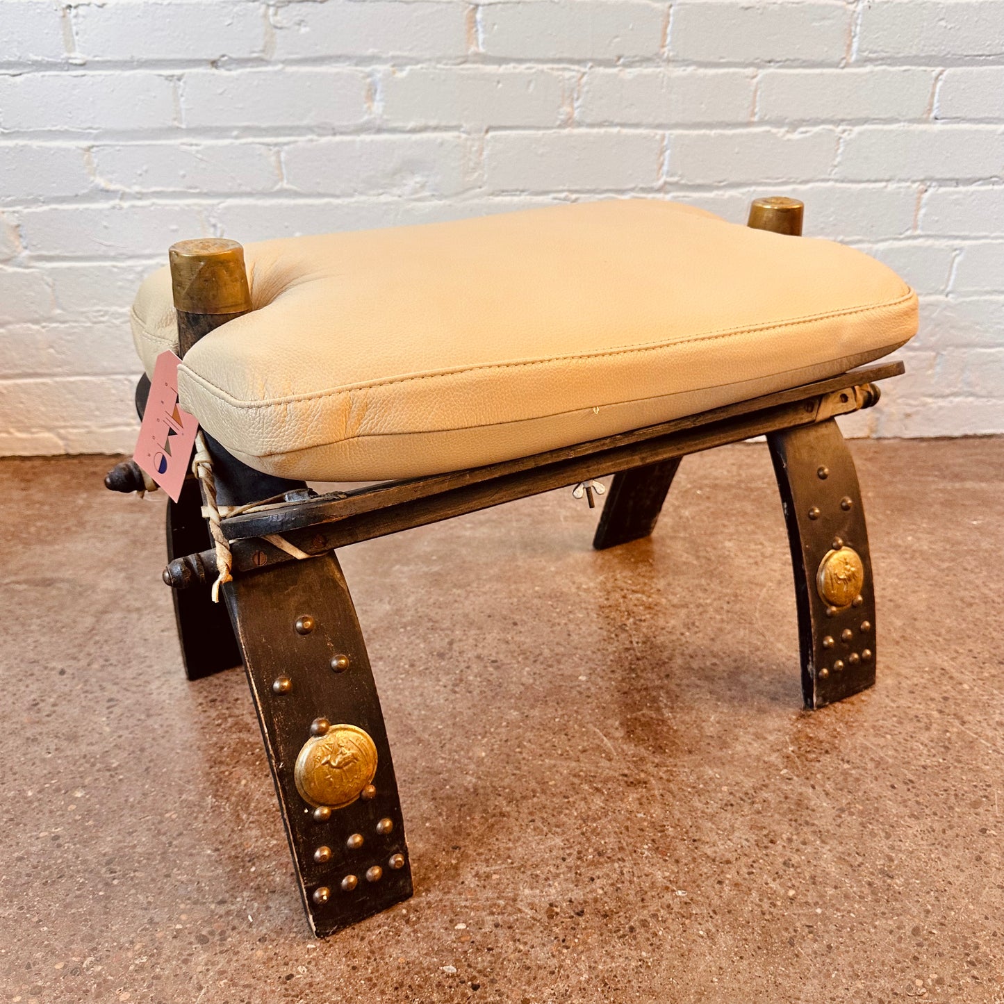 REUPHOLSTERED LEATHER CAMEL SADDLE OTTOMAN