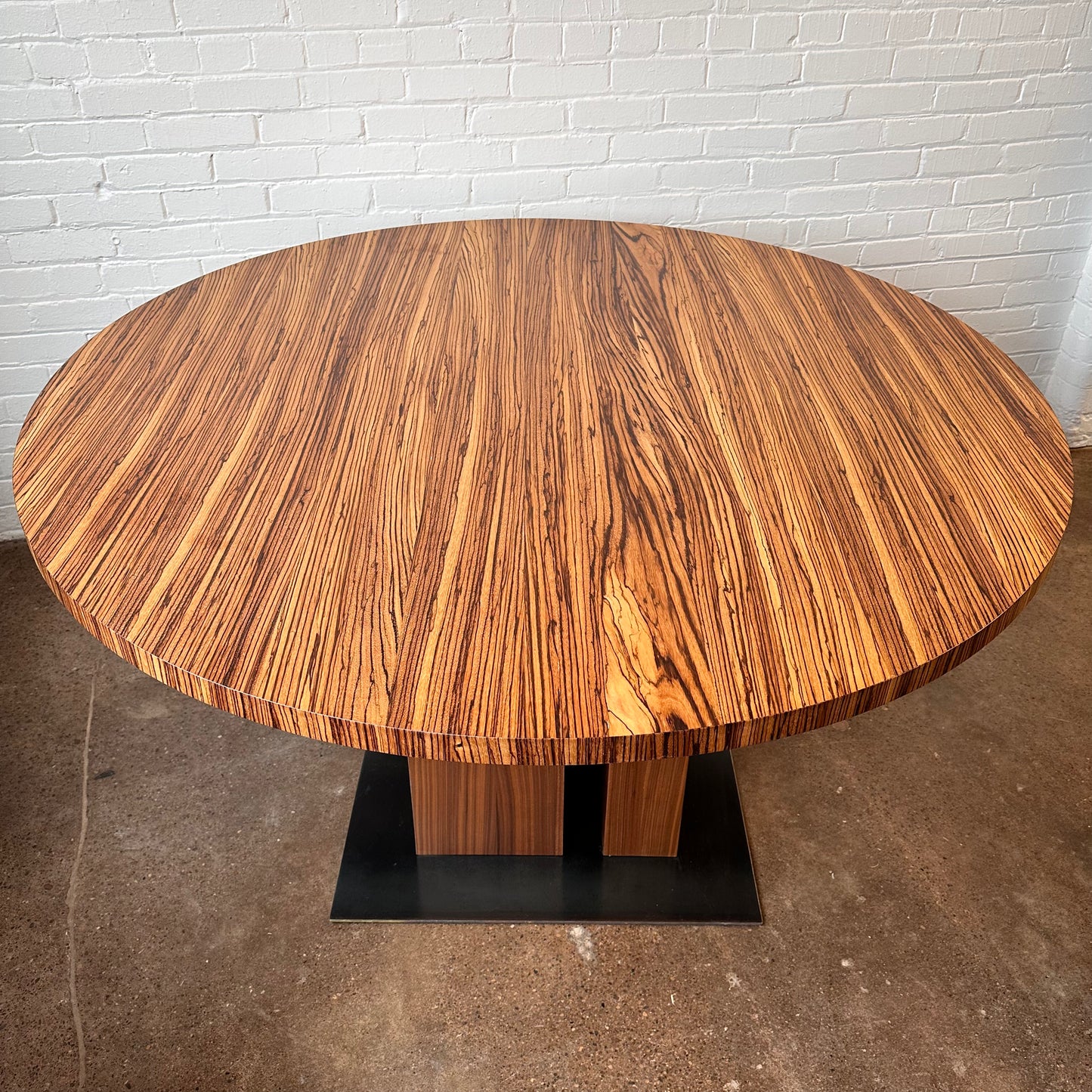 MODERN ROUND ZEBRA WOOD DINING TABLE WITH STEEL BASE