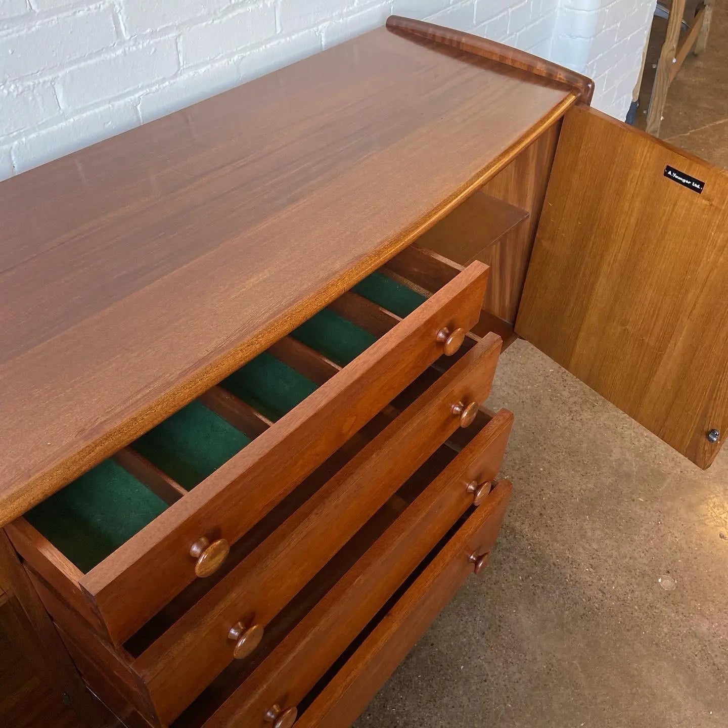 A YOUNGER CREDENZA IN AFROMOSIA & TEAK BY JOHN HUBERT