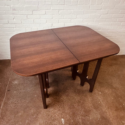 WALNUT DINING TABLE WITH SCULPTURAL BASE