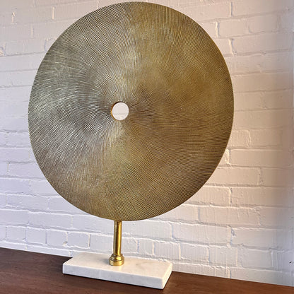 CAST METAL DISC SCULPTURE ON MARBLE BASE