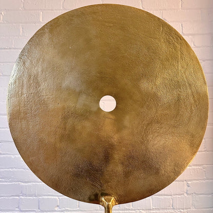 CAST METAL DISC SCULPTURE ON MARBLE BASE