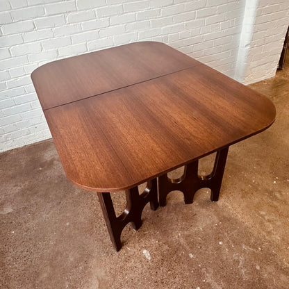 WALNUT DINING TABLE WITH SCULPTURAL BASE