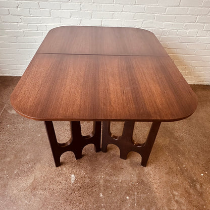 WALNUT DINING TABLE WITH SCULPTURAL BASE