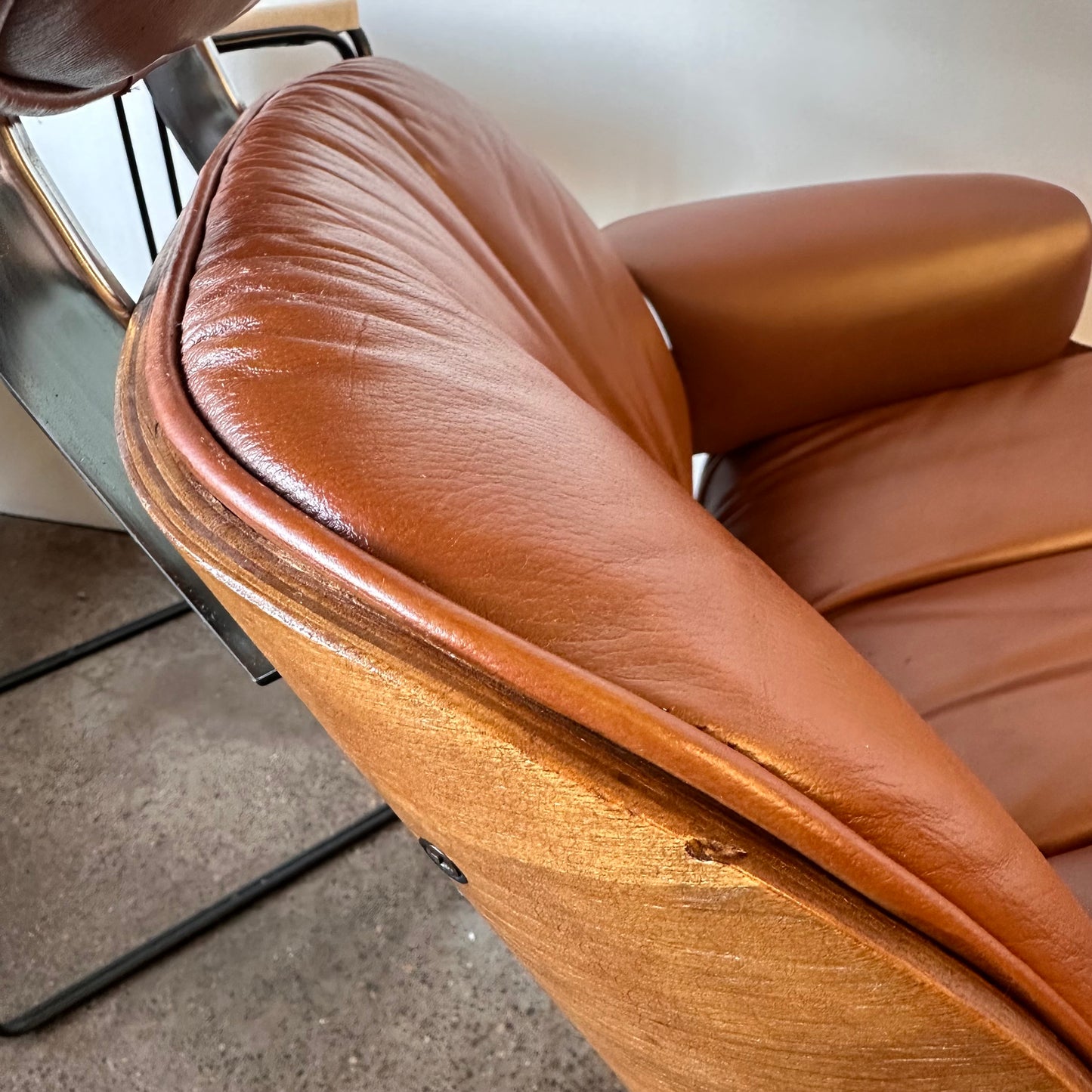 VINTAGE PLYCRAFT COGNAC AND WALNUT LOUNGE CHAIR AND OTTOMAN