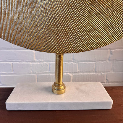CAST METAL DISC SCULPTURE ON MARBLE BASE