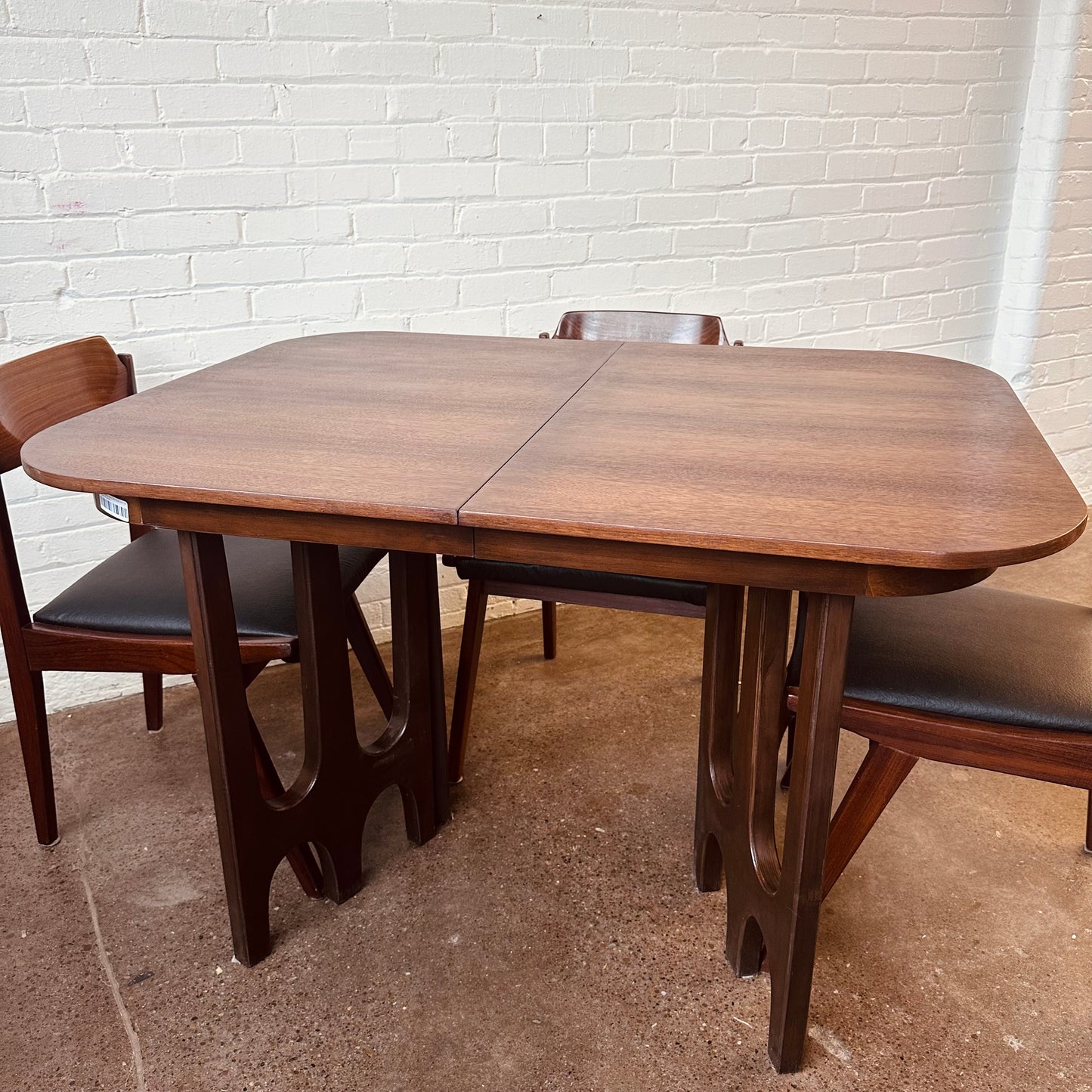 WALNUT DINING TABLE WITH SCULPTURAL BASE
