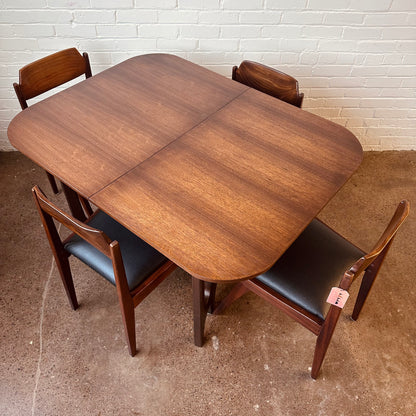 WALNUT DINING TABLE WITH SCULPTURAL BASE