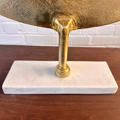 CAST METAL DISC SCULPTURE ON MARBLE BASE