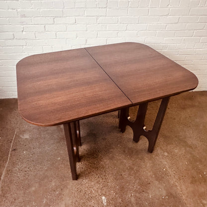 WALNUT DINING TABLE WITH SCULPTURAL BASE