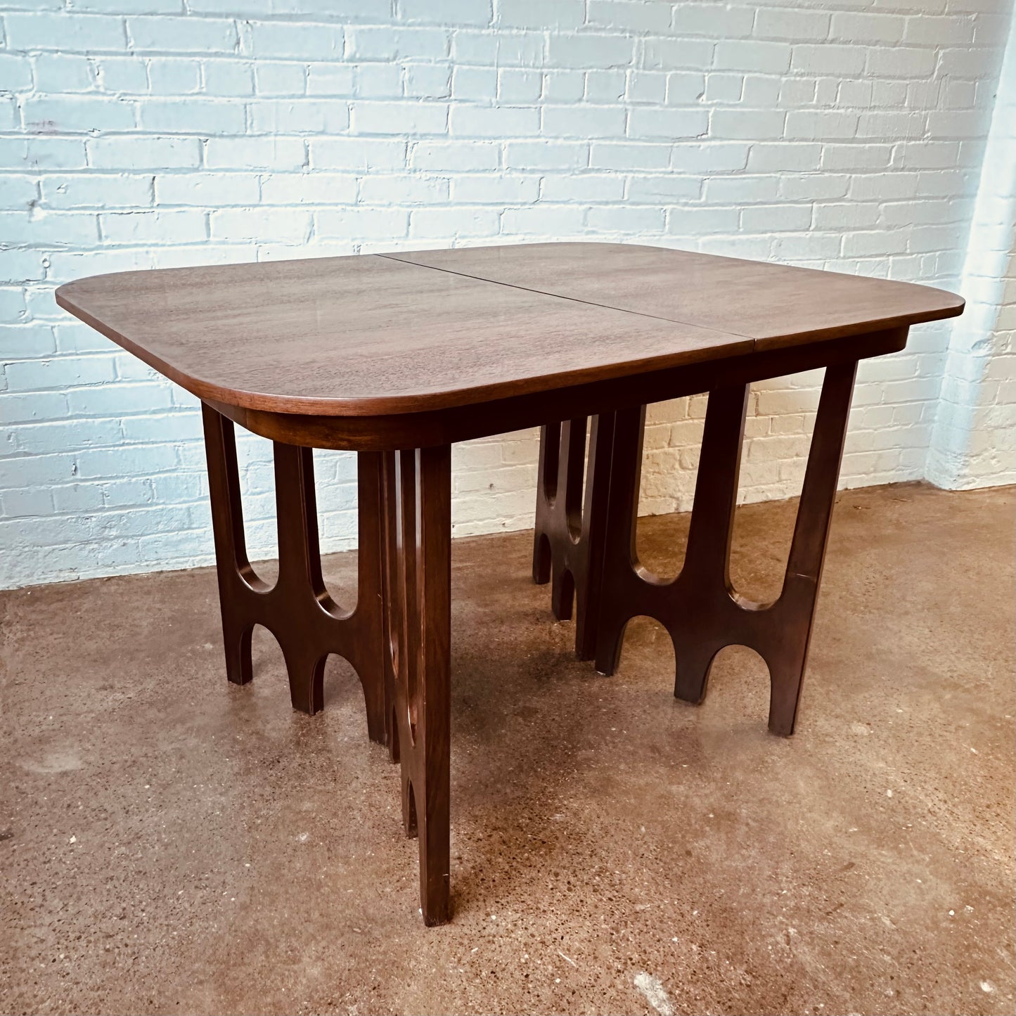 WALNUT DINING TABLE WITH SCULPTURAL BASE