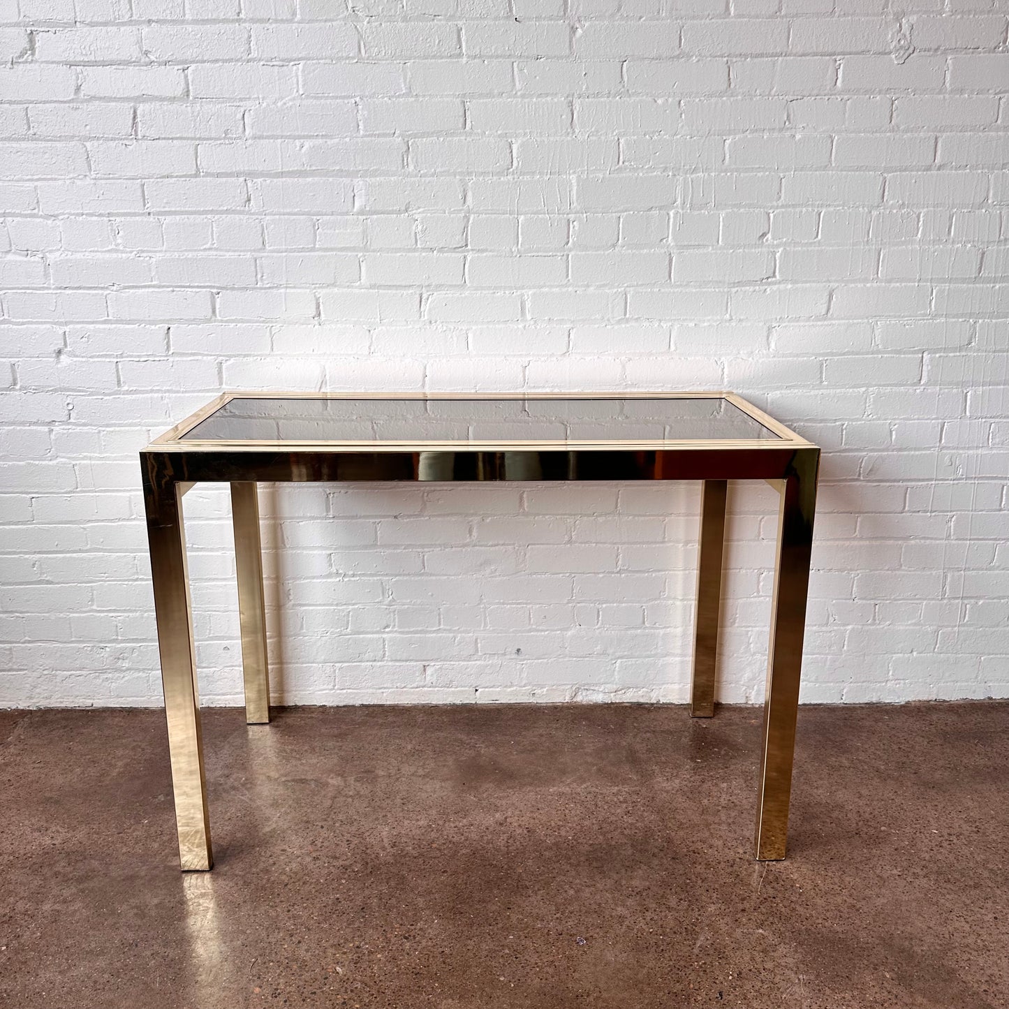 EXPANDABLE BRASS CONSOLE TABLE BY DESIGN INSTITUTE OF AMERICA