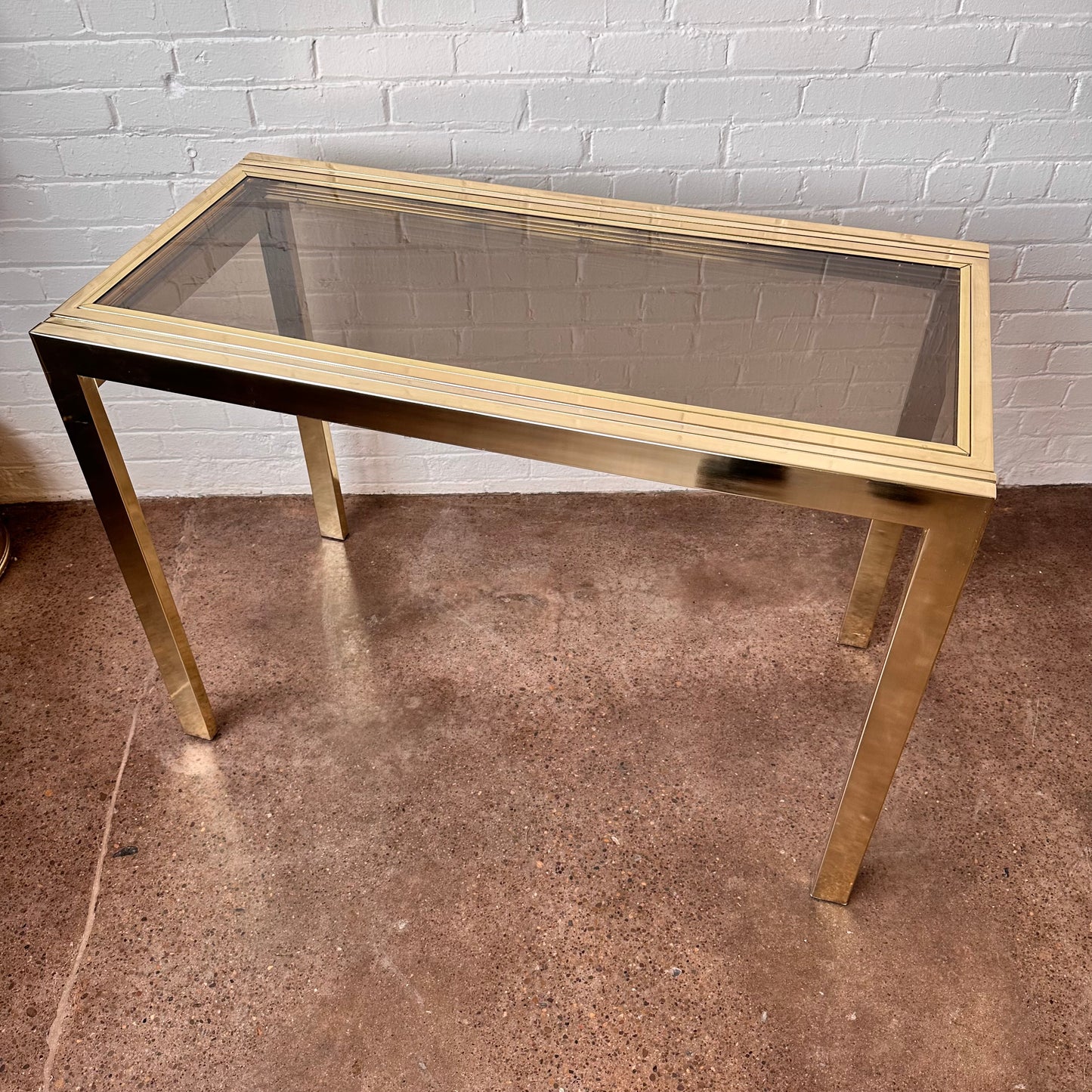 EXPANDABLE BRASS CONSOLE TABLE BY DESIGN INSTITUTE OF AMERICA