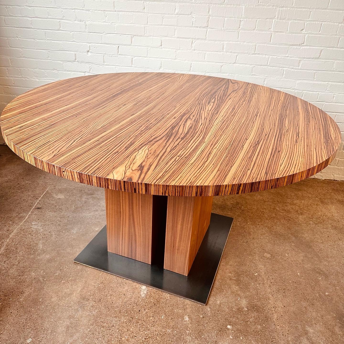 MODERN ROUND ZEBRA WOOD DINING TABLE WITH STEEL BASE