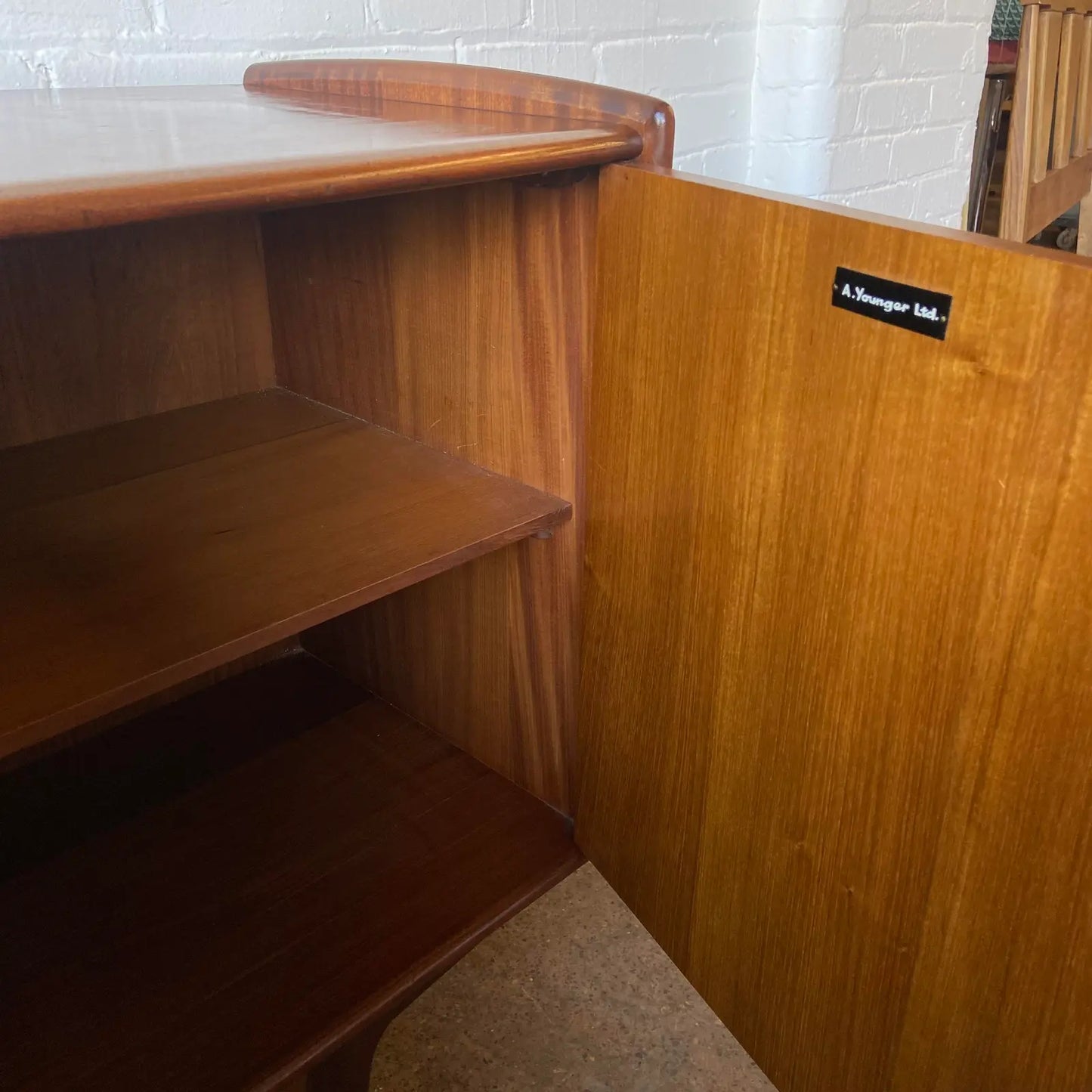 A YOUNGER CREDENZA IN AFROMOSIA & TEAK BY JOHN HUBERT